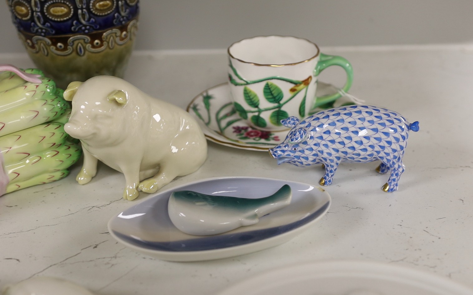 A Herend asparagus box and pig, a Belleek pig, six Bing & Grondahl plaques, a Worcester cup and saucer, a Royal Doulton vase and three other items